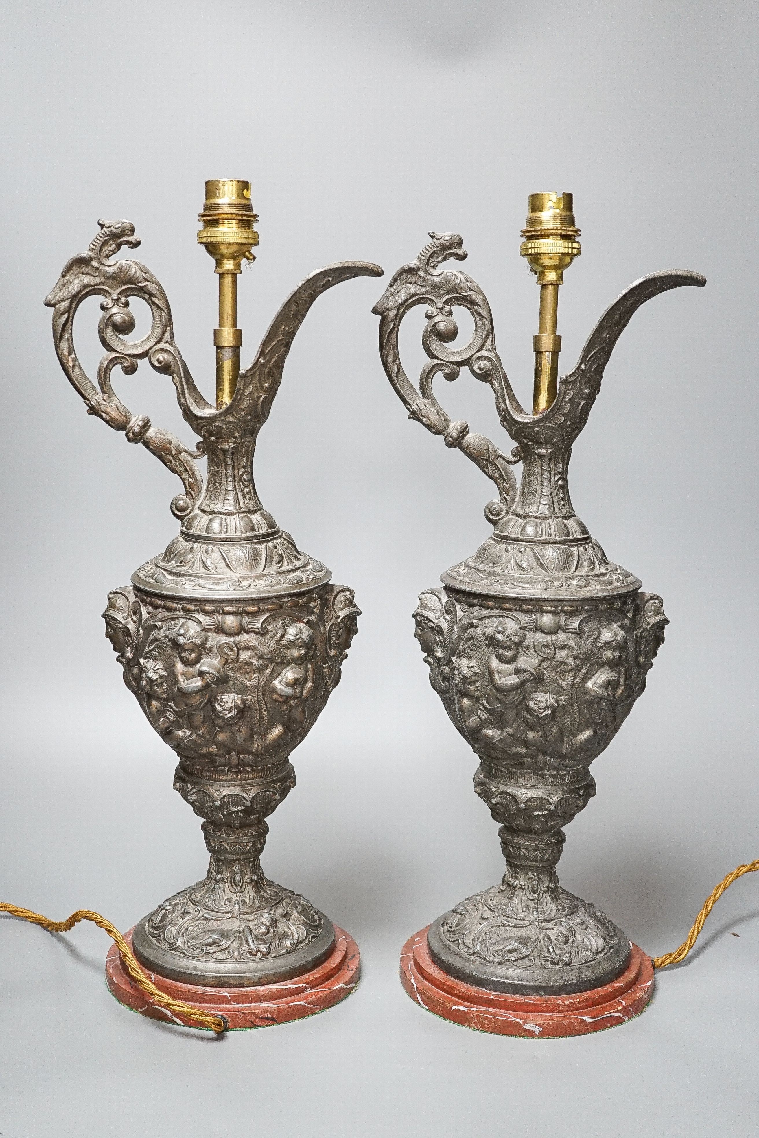 A pair of early 20th century spelter ewers mounted as lamps 42cm
